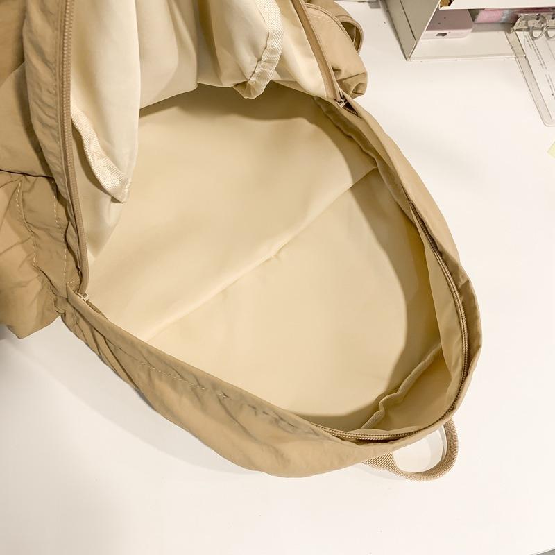 Niche design new simple backpack travel versatile backpack lightweight solid color large capacity student bag