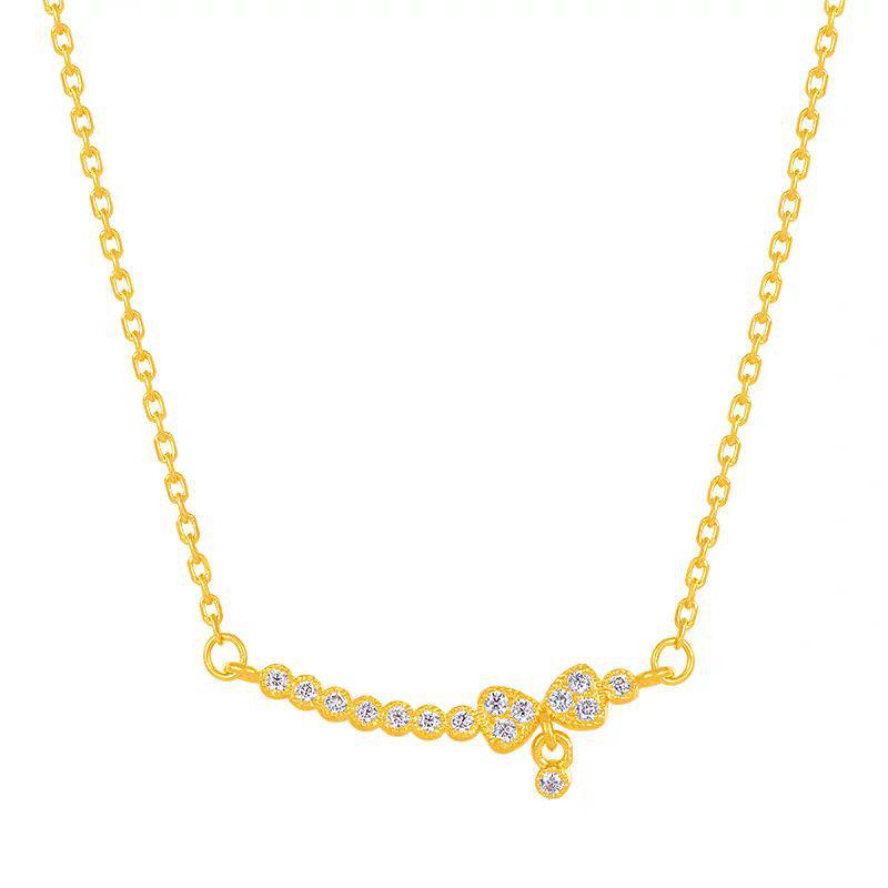 Collier Femme Doré Souriant avec Nœud, Chaîne de Clavicule Luxe Léger et Pendentif Imitation Or