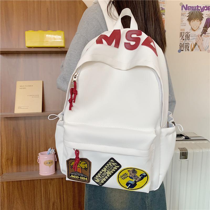 New high-value backpack, junior high school student schoolbag, women's leisure, light commuting, going out for travel, large-capacity backpack.