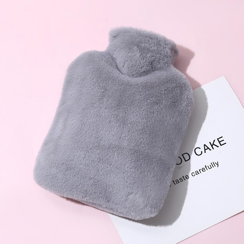 Thickened, explosion-proof hot water bottle for girls with imitation rabbit fur; perfect as a hand warmer, stomach compress, or foot warmer.