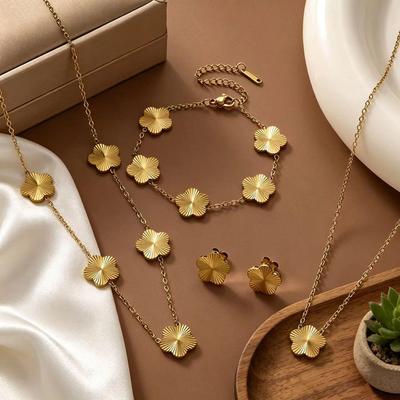 Gold-Plated Titanium Steel Four-Leaf Clover Jewelry Set: Necklace, Bracelet & Earrings for Women – Luxurious High-End Feel.