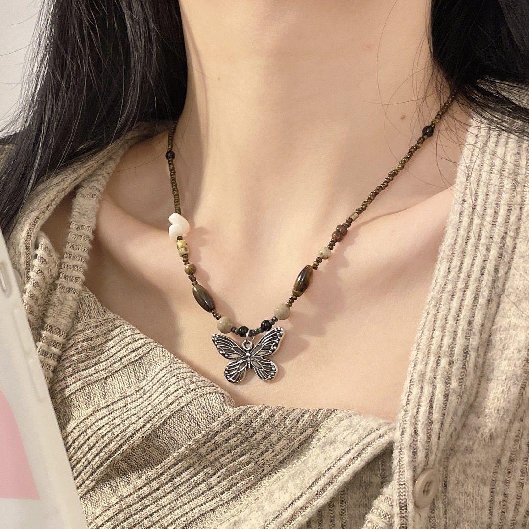 

New Chinese retro beaded butterfly necklace women s light luxury niche design is decorated with inner decoration and layered collarbone