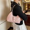 Solid color crescent-shaped hobo bag with metal D-ring embellishment, elegant underarm bag, versatile women's handbag for dates and everyday wear.
