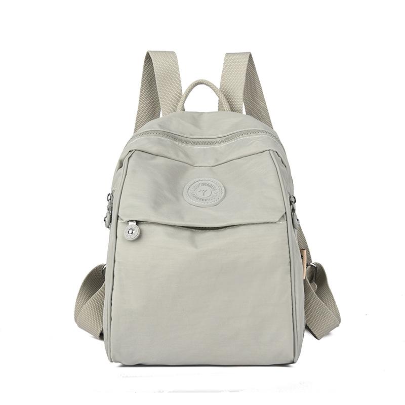 

Студентський шкільний рюкзак великої місткості, жіночий рюкзак, легкий водовідштовхувальний нейлоновий рюкзак для поїздок на роботу та подорожей Large світло-сірий колір