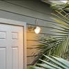 Gooseneck Brass Wall Sconce with Globe — Curved‑Arm Indoor/Outdoor Light Fixture