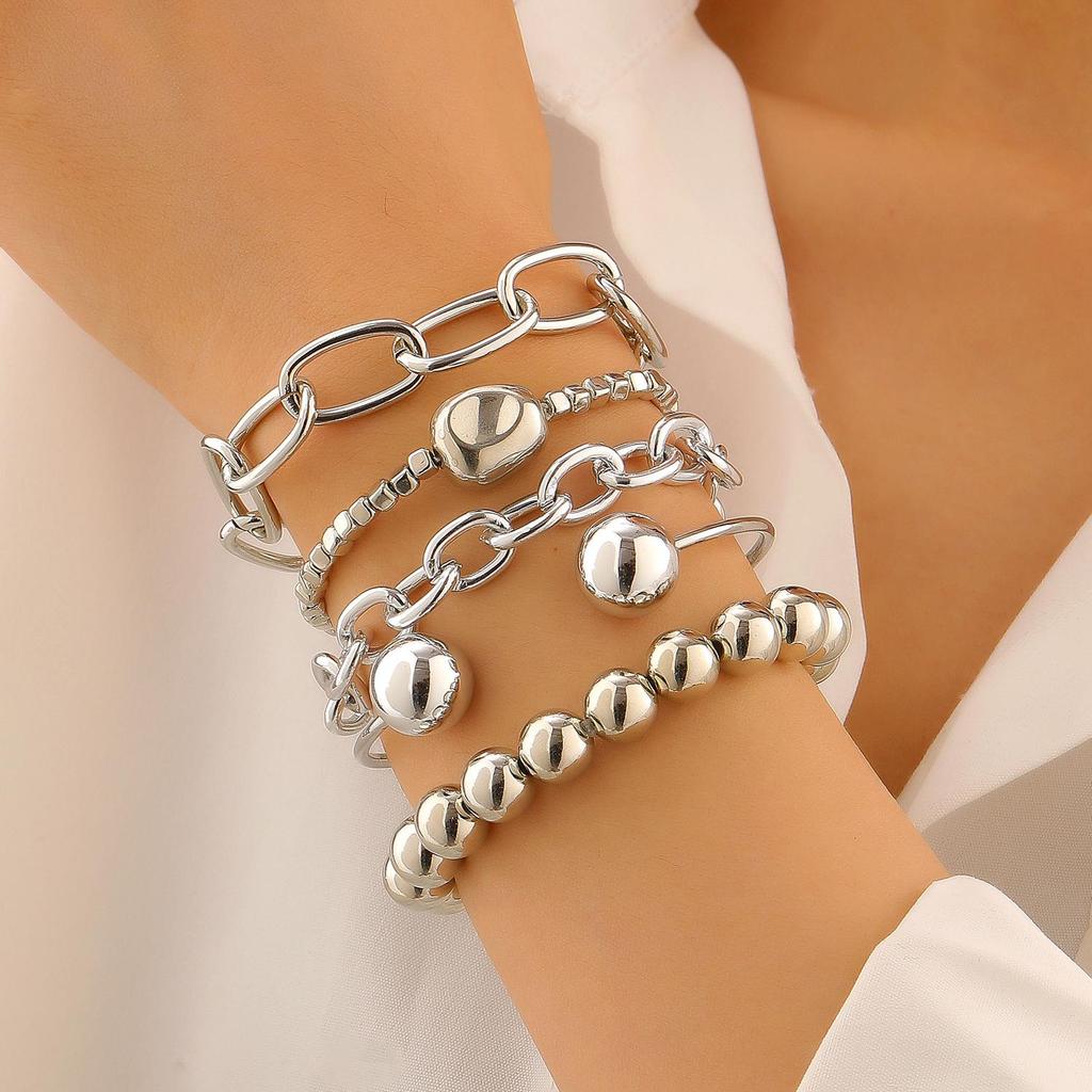 Conjunto de Pulseras de Aleación Dorada Estilo Étnico para Mujer - Colección de Pulseras Retro de Diez Piezas