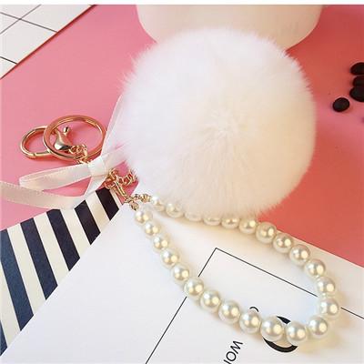 Auto Damen Handtasche Schlüsselanhänger Mode Perlenkette Kristallflasche Schleife Pompon Schlüsselanhänger Flauschiger Pompom Schlüsselanhänger Schmuck
