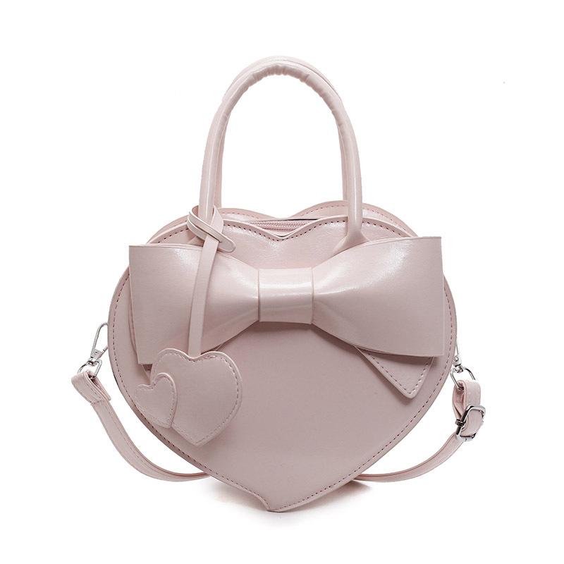 

Новинка этого года модная и высококлассная, портативная сумка-коробка с бантом и персиковым сердцем, универсальная нишевая женская сумка-мессенджер в зарубежном стиле. розовый