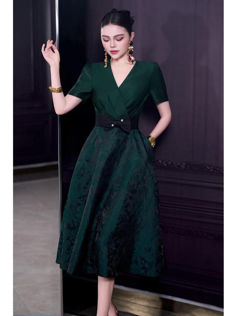French Spring/Summer 2026 Women's V-Neck Black Bow Tie Jacquard Dress with Waist-Cinching and Wide Hem.