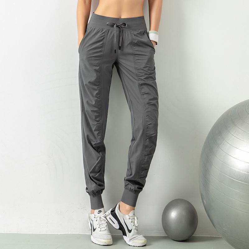 2021 Spring Women's Breathable Loose Fit Nine-Point Running Pants with Pockets
