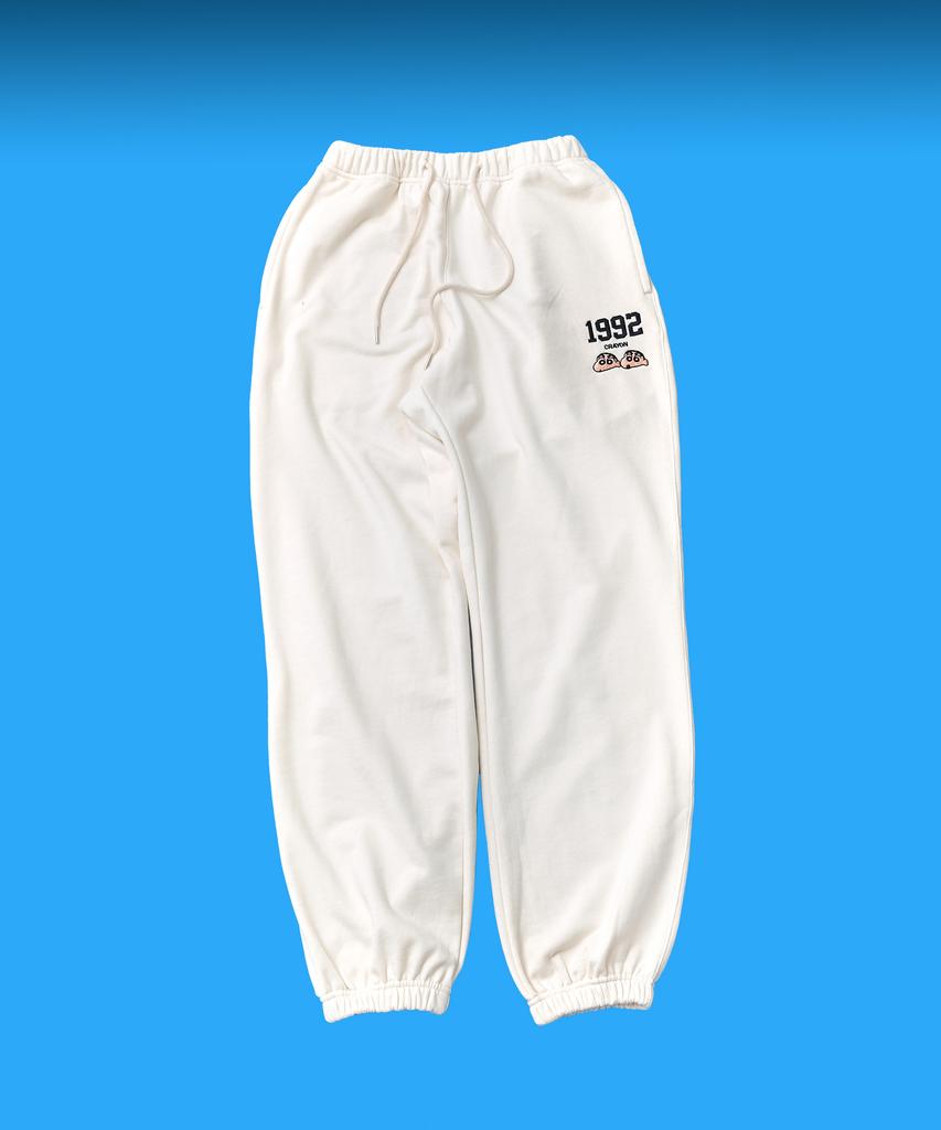 Daenkkomma Crayon Shin-Chan 1992 Face Embroidery Sweatpants (Black, Cream)
