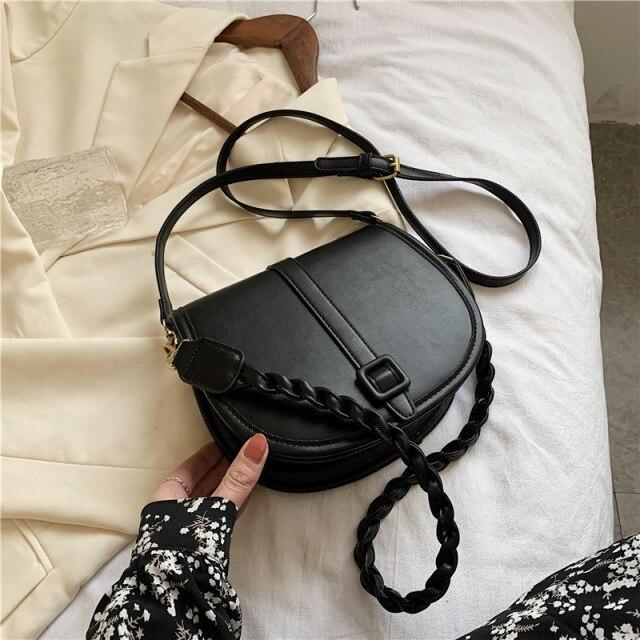 black weave crossbody bolsa
