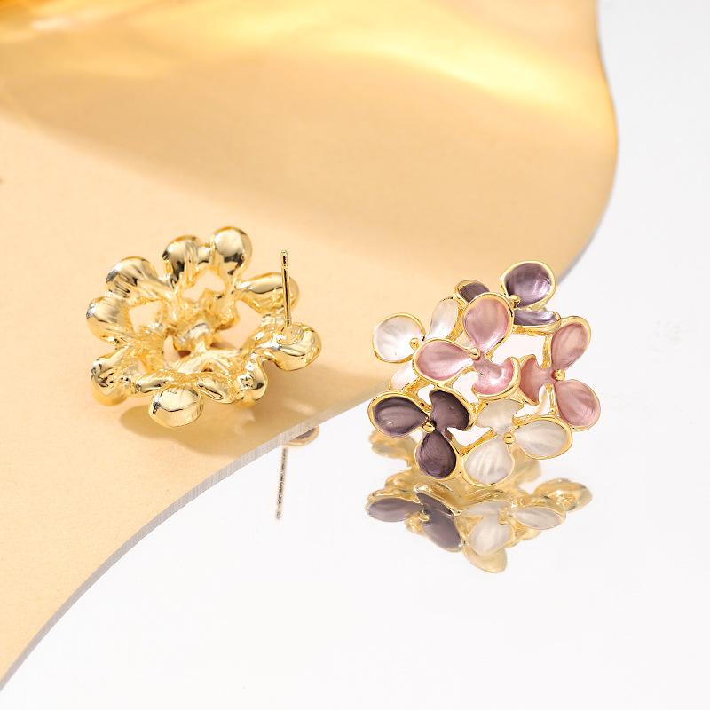 Sweet temperament small fresh drop glaze hollow flower leaf stud earrings light luxury niche high-end fairy earrings