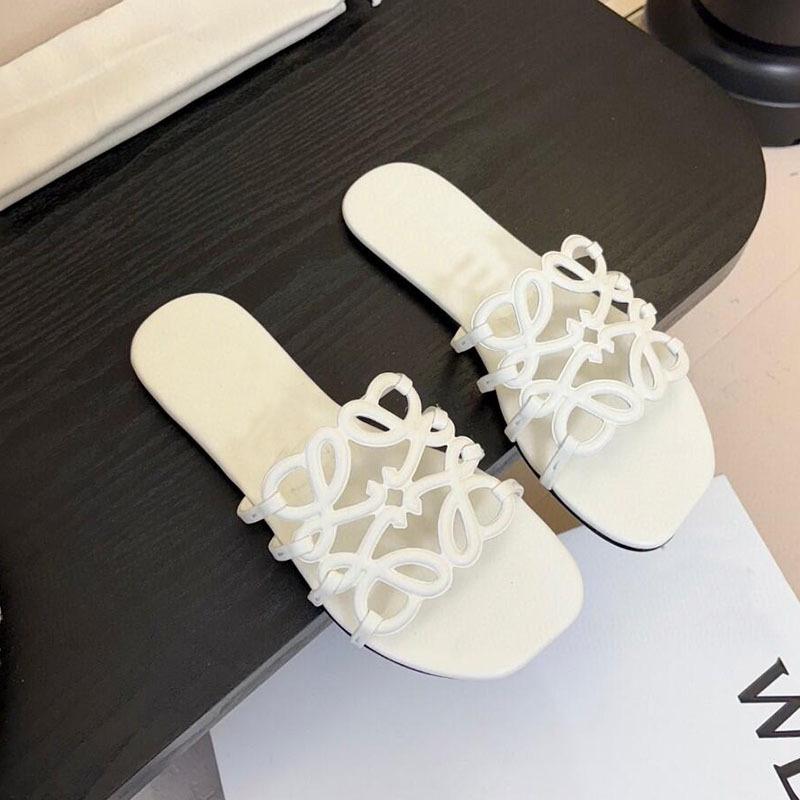 

Flat-bottomed slippers one-word casual summer new niche leather hollowed-out vacation beach cool slippers outside 35