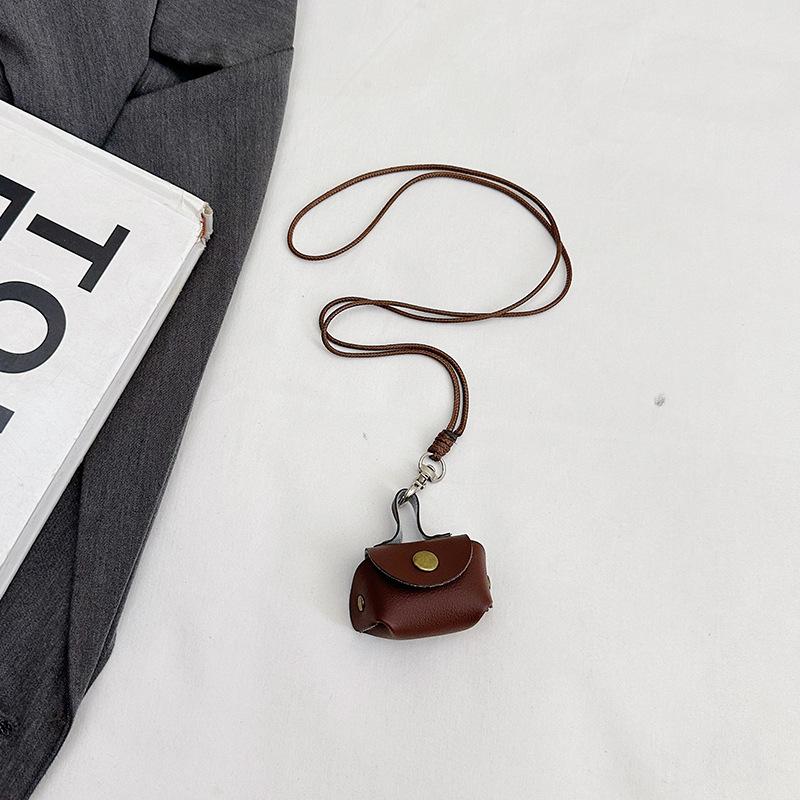 This year, it is super popular. Leather earphones, bags, neck hanging, hand carrying women's mini storage accessories, small bags, pendant keychains.