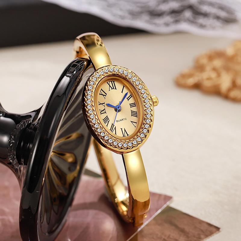 Elegant Women's Oval Bangle Watch Crystal Bezel Gold Tone Quartz Wristwatch Ladies Dress Watch
