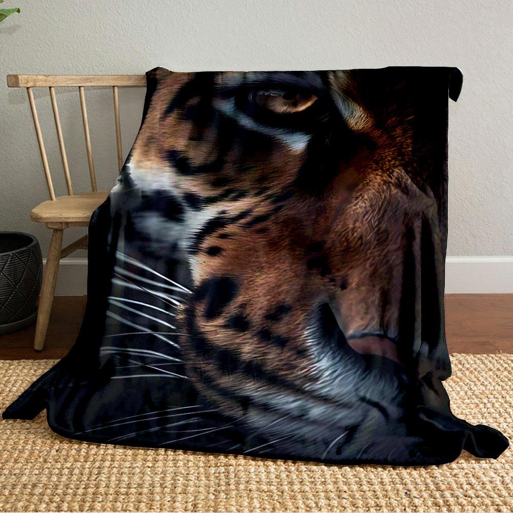 Close-up of tiger's face with striped fur pattern and piercing eye. for all seasons blanket lunch break throw gift