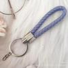 Gevlochten Lederen Touw Sleutelhanger met Poppenhanger - Modieus en Creatief Accessoire