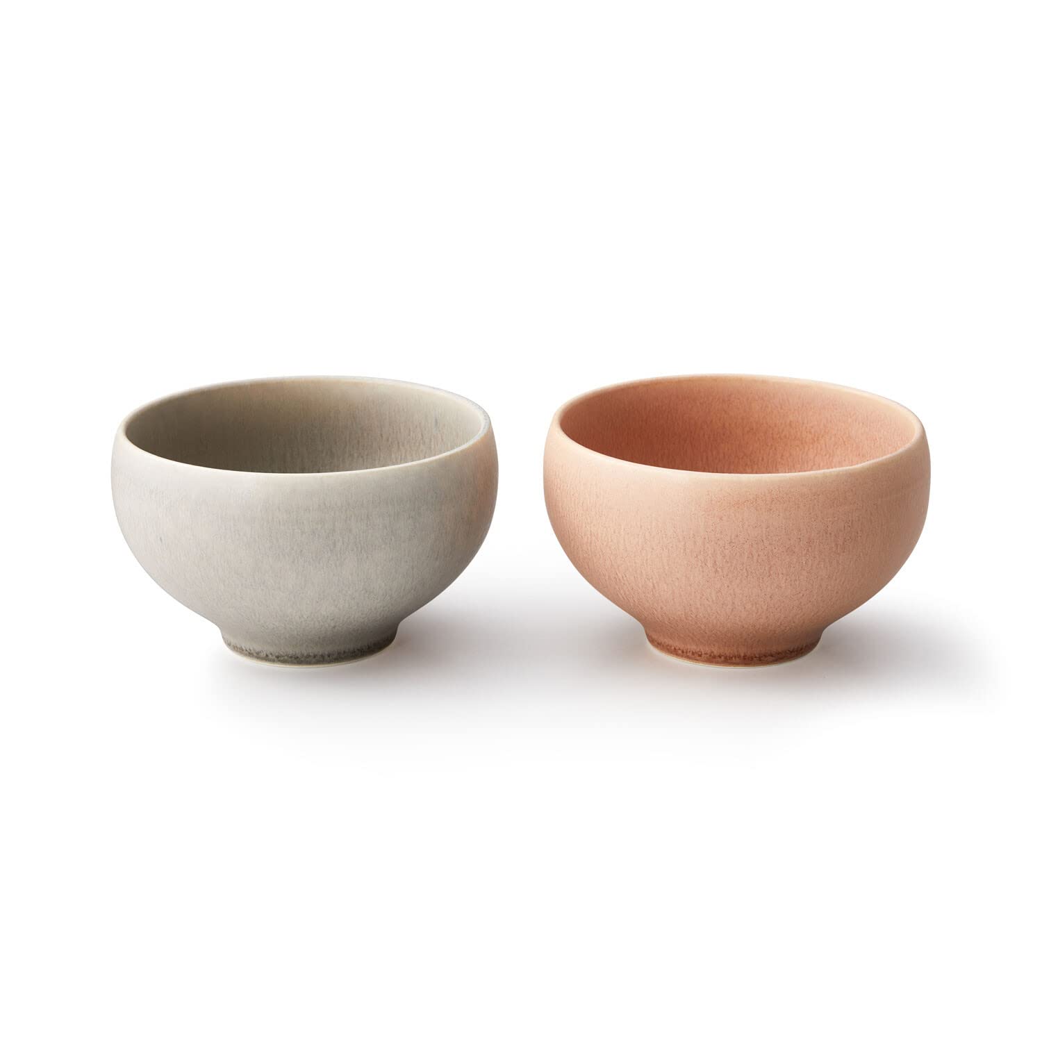 

A pair of bowls, each 12.5cm diameter x 7.6cm high, measuring 540ml, with a soft, crystalline glass-like texture. The pair, gray and pink, make a perf