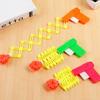 Einziehbare Faust-Shooter-Trick-Spielzeugpistole, lustiges Kinderstreichspielzeug, Kinder-Kunststoff-Festival-Geschenk zum Spaß, klassische elastische Teleskop-Faust