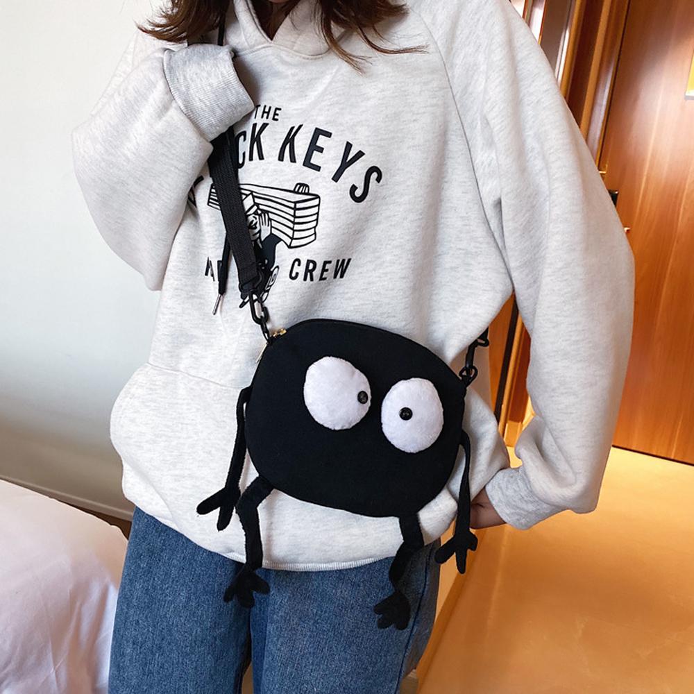 New Cartoon Big-eyed Monster Women's Bag Small Messenger Bag Unisex Black Canvas Shoulder Bag Telescopic shoulder strap Handbags