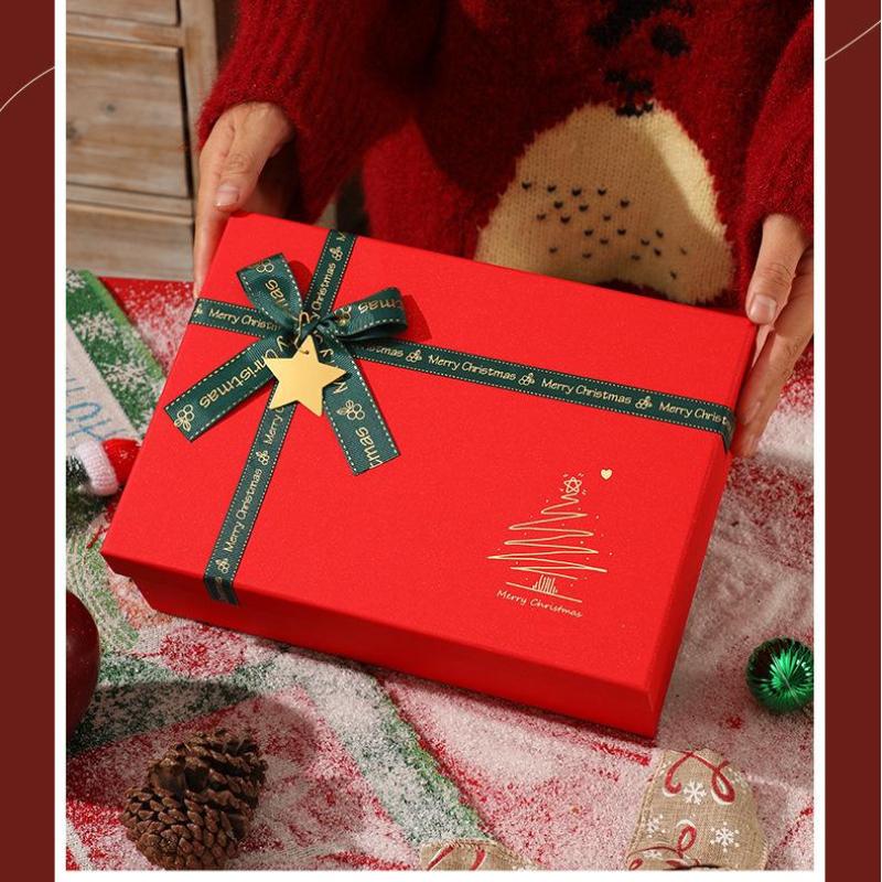 Red Christmas Gift Box With Shiny Surface Green Ribbon Gold Star Ornament Ideal For Holiday Gift Wrapping