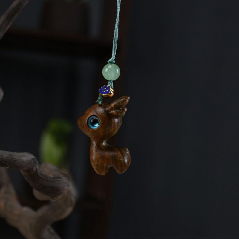 Twelve Zodiac Animal Charms Green Sandalwood Set: Rat, Ox, Tiger, Rabbit, Dragon, Snake, Horse, Sheep, Monkey, Rooster, Dog, Pig.