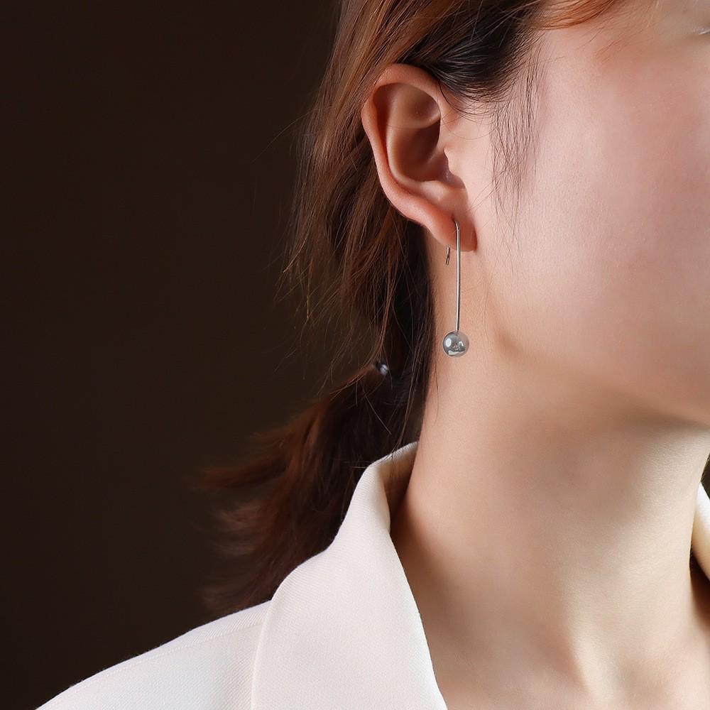 Boucles d'oreilles pendantes minimalistes européennes et américaines polyvalentes en forme de goutte d'eau pour femmes