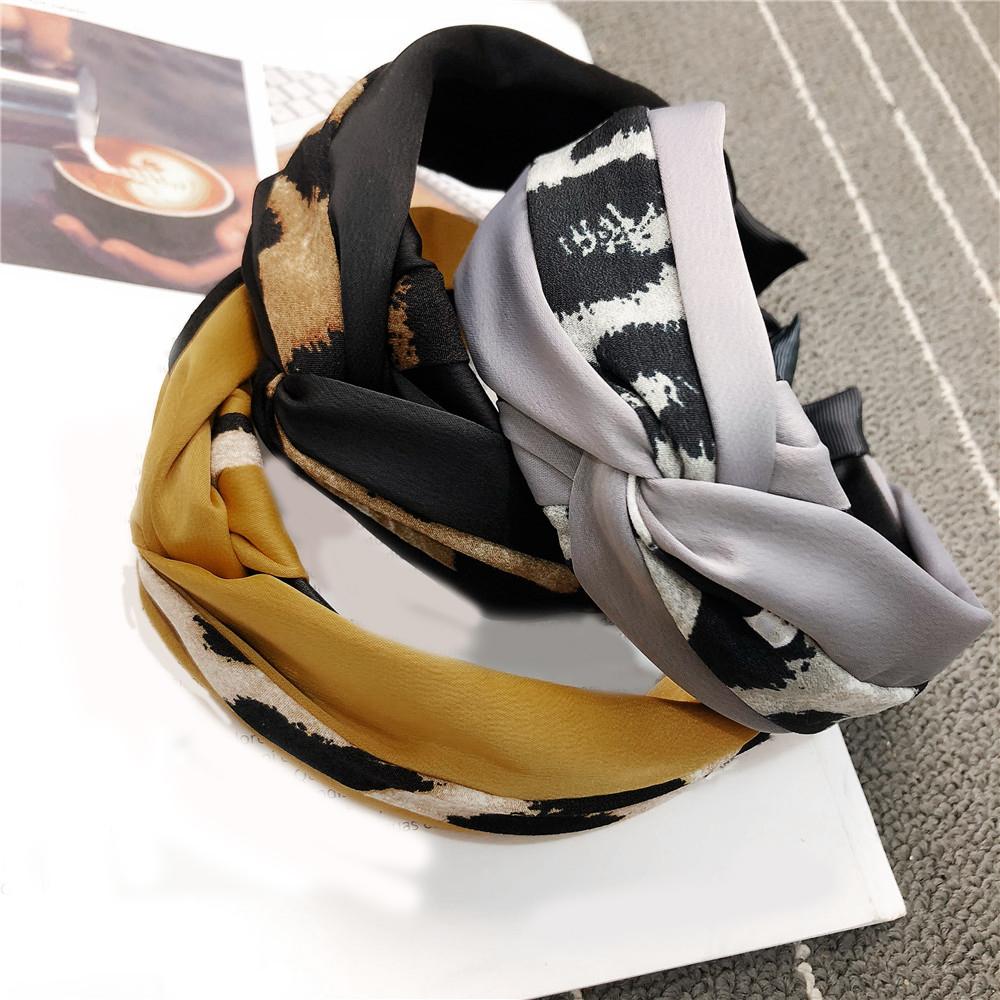A unique leopard print color-blocked knotted headband with a goddess-like charm and a trendy fabric wide headband