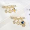 Blue-Eyed Palm Crown Letter Zircon Brooch Fashionable Personalized Retro God's Eye Design New Wholesale Brooch