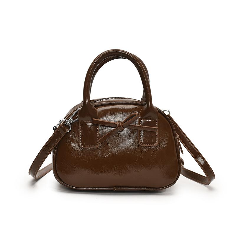 

Популярная в Южной Корее нишевая простая однотонная портативная сумка для боулинга, женская повседневная в иностранном стиле, высококачественная универсальная сумка-мессенджер коричневый