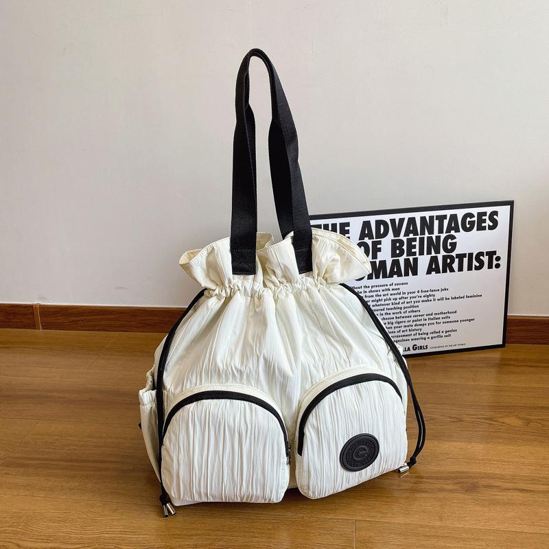 Niche design backpack women's new leisure travel lightweight drawstring shoulder bag large capacity backpack