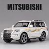 Cwvjgx1 Maßstab 1:32 MITSUBISHI PAJERO Spielzeug-SUV-Automodell Legierung Druckguss Gummireifen Türen zu öffnen Simulations-Geländewagen Geschenk für Kind