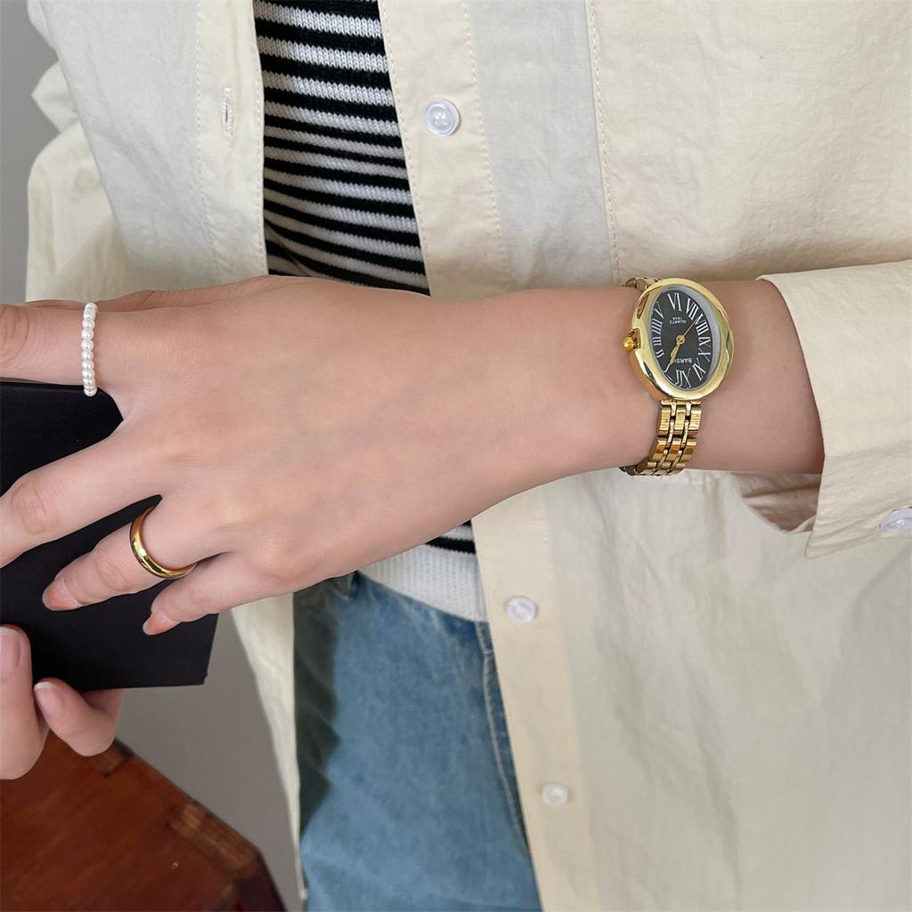 Retro gold women's watch, fashionable oval shaped temperament, steel strap, quartz watch
