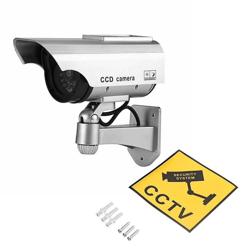 

Манекен камери відеоспостереження на сонячних батареях для внутрішнього використання на відкритому повітрі для дому та офісу. Миготливий світлодіодний червоний світло, водонепроникний срібний