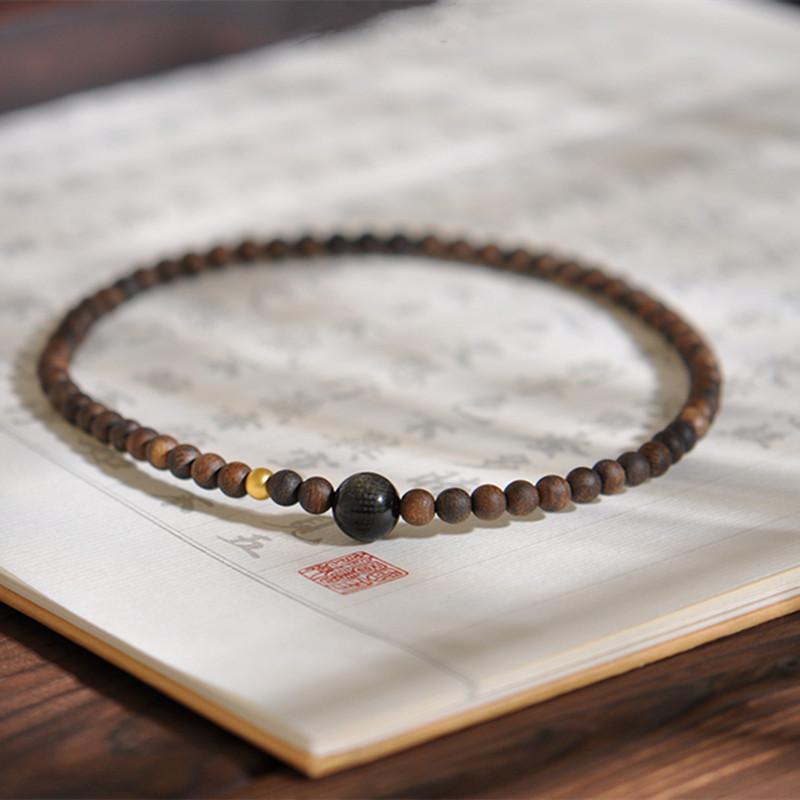 

Natural Brunei Agarwood5mm Double-ring bracelet paired with obsidian and ancient-style gold Buddha beads, vintage style for women
