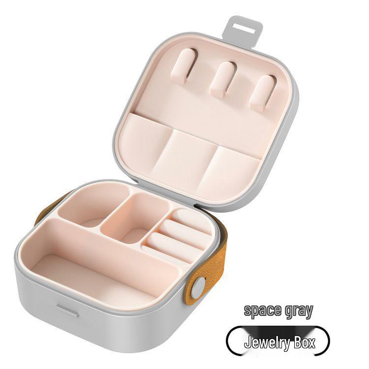 

Компактна багатофункціональна коробка для зберігання ювелірних виробів та помади