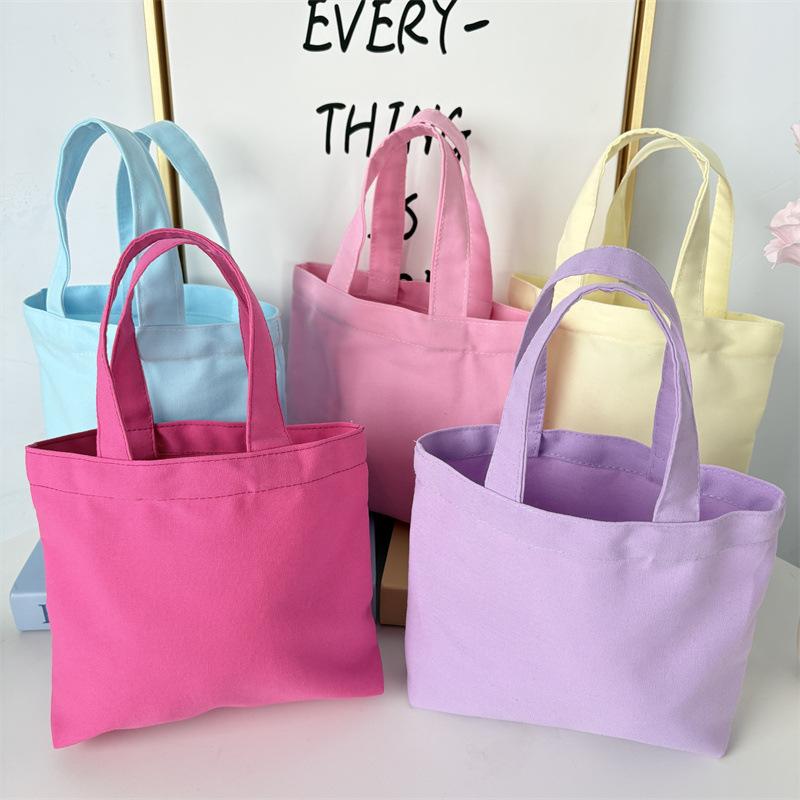 Effenkleurige eenvoudige lunchtas, draagbare canvas tas, kleine stoffen tas, draagbare canvas tas voor het opbergen van diverse spullen