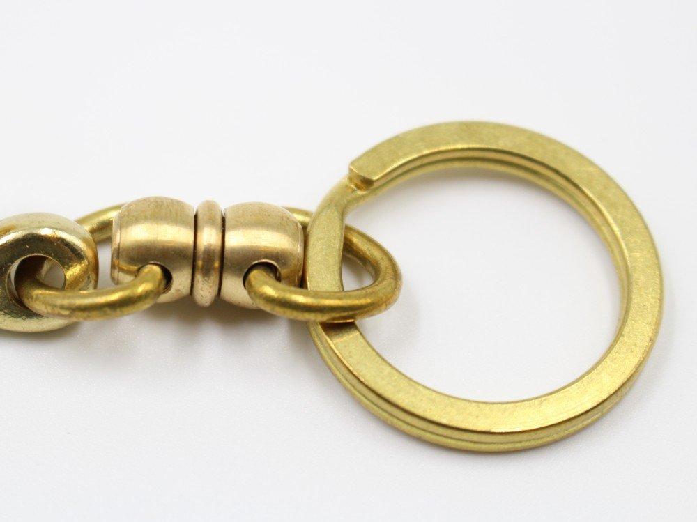 Heavy-duty fishing hook keychain with swivel and double ring, made of brass.