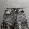 Jeans da uomo in denim elasticizzato nero con dettaglio ricamato, gamba leggermente svasata, vita media, stile casual streetwear