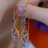 Cat's Eye Tassel Ear Chain 2024 Trend: Elegant Long Earrings with Light Luxury Design