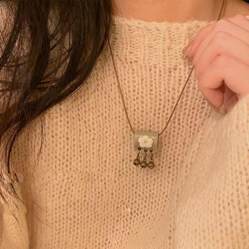 Retro ceramic butterfly bell pendant necklace women s new trendy long sweater chain with accessories