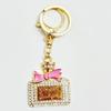 Radiant Bow Perfume Bottle Keychain & Elegant Bag Pendant Gift