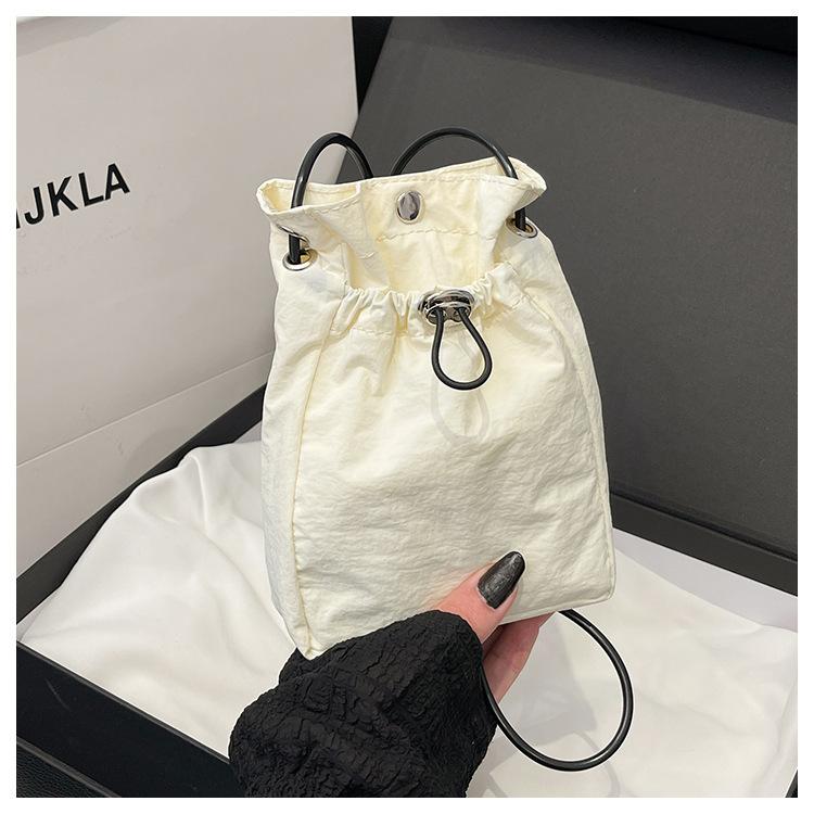 Minimalist style Japan and South Korea light drawstring canvas trend 2025 personalized solid color shoulder crossbody change mobile phone bag women's