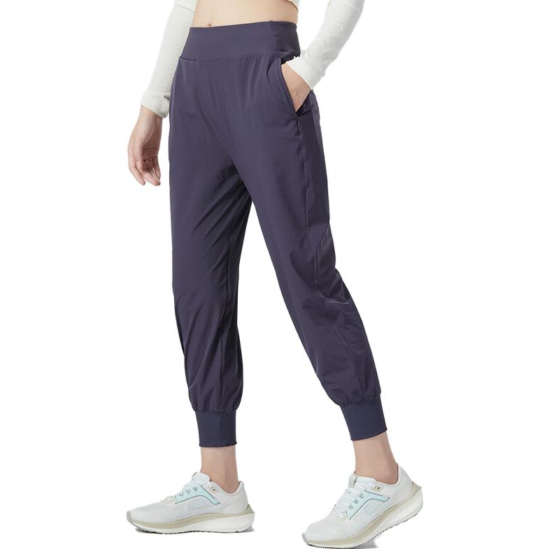 Nike Jednobarevné sportovní ležérní kalhoty s elastickým pasem a manžetami Dámské spodní díly Fialová DV9454-015