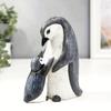 A Set of Two Resin Statues Featuring a Mother And Penguin Showcasing a Creative Family Theme These Can Serve As Decorative Pieces for Home