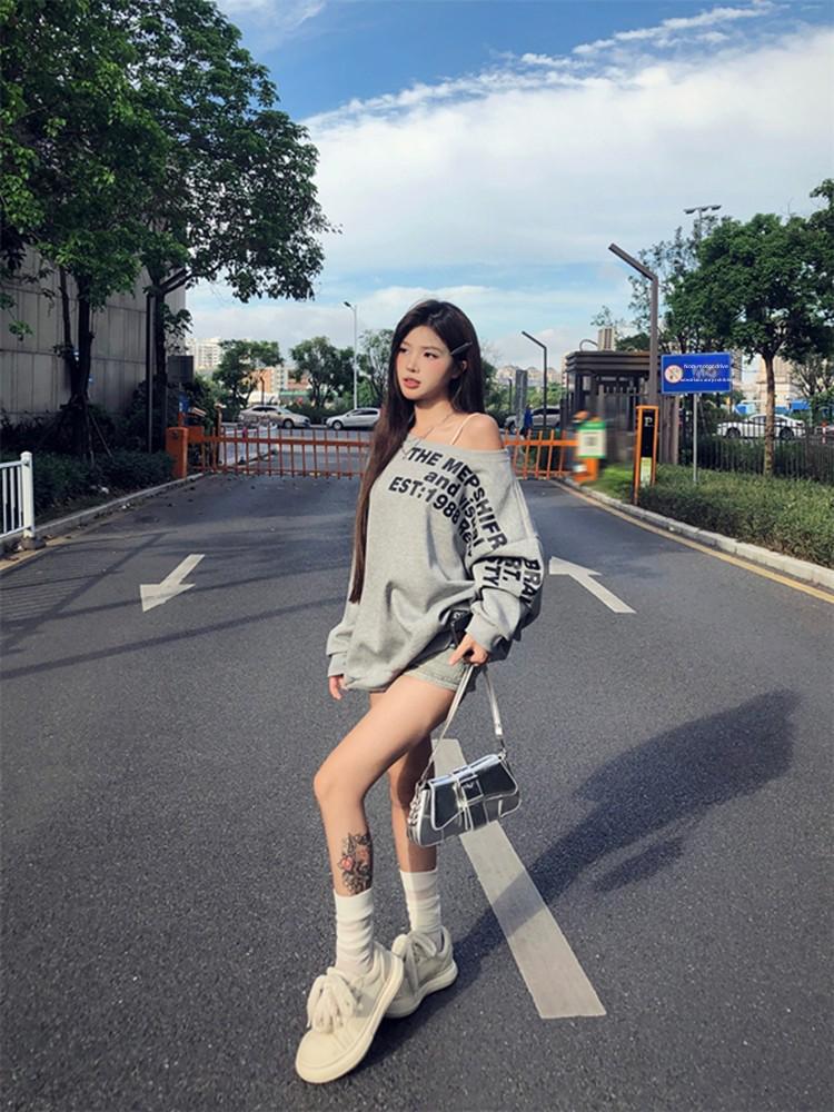 American-Style Oversized Off-Shoulder Sweater: Letter Print, Long Sleeve, Casual Loose Fit for Women In Early Autumn.