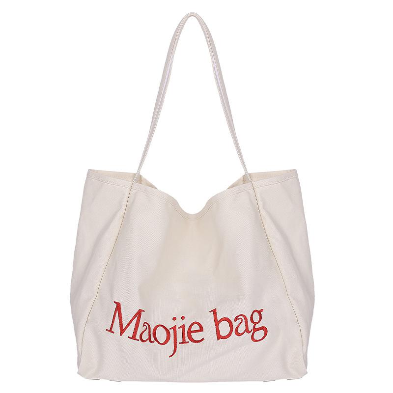 Large-capacity canvas bag, new niche versatile casual class commuting portable shoulder tote bag