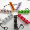 Reißverschluss Vier-Tasten Ein-Schriftzug Mechanische Tastatur, Schaltertester, Fingerquetsch-Musik-Dekompressionsknopf, Schlüsselanhänger, Buntes Glitzern