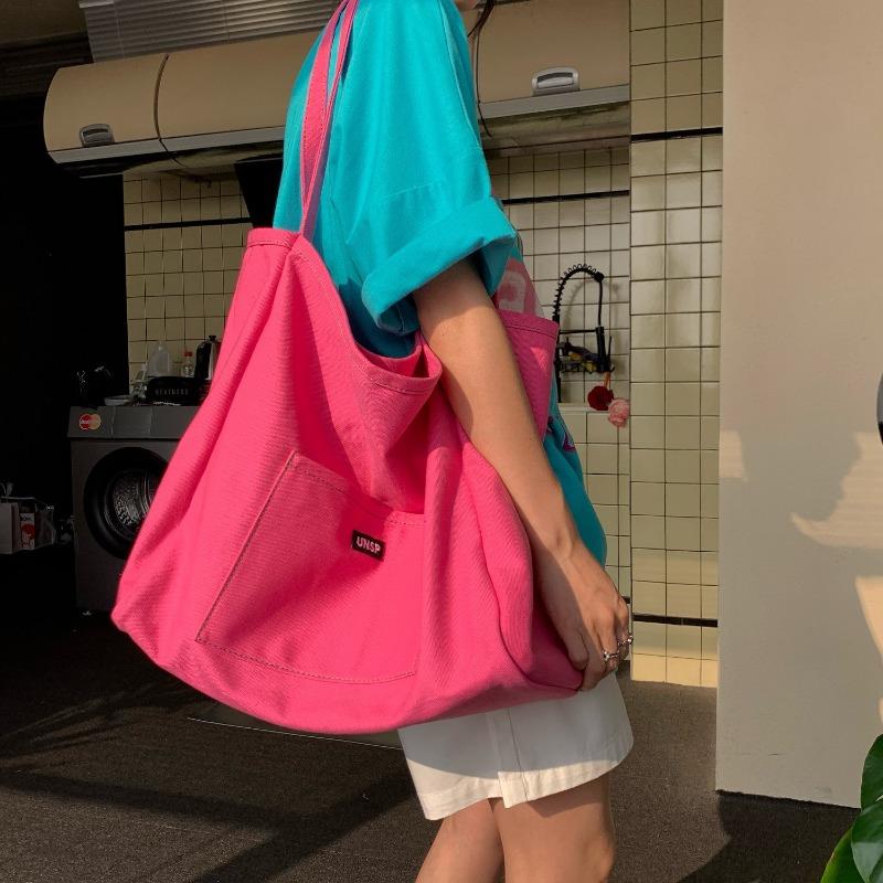 

Solid color canvas bag new women s bag large capacity simple shoulder oblique span bag simple and versatile троянди рожеві кольору